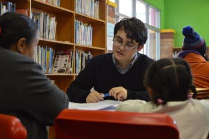 A Law and Human Rights volunteer assists at a legal clinic Legal clinic in session in Mitchells Plain, Cape Town